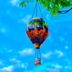 Hanging butterfly solar balloon lantern over flowers, perfect for garden solar decor and front yard decorations
