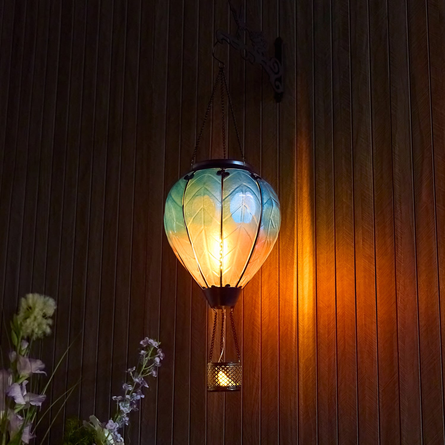 Blue hand-painted solar hot air balloon lantern for backyard decorations, patio decor, and garden solar lights with a warm flame-effect glow