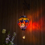 Butterfly design lantern with flame-style solar light, ideal for patio solar LED lights and seasonal yard decorations