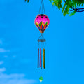 Colorful glass solar hot air balloon lantern with a hanging wind chime for backyard decorations, patio décor, and garden solar lights featuring a warm flame-effect glow