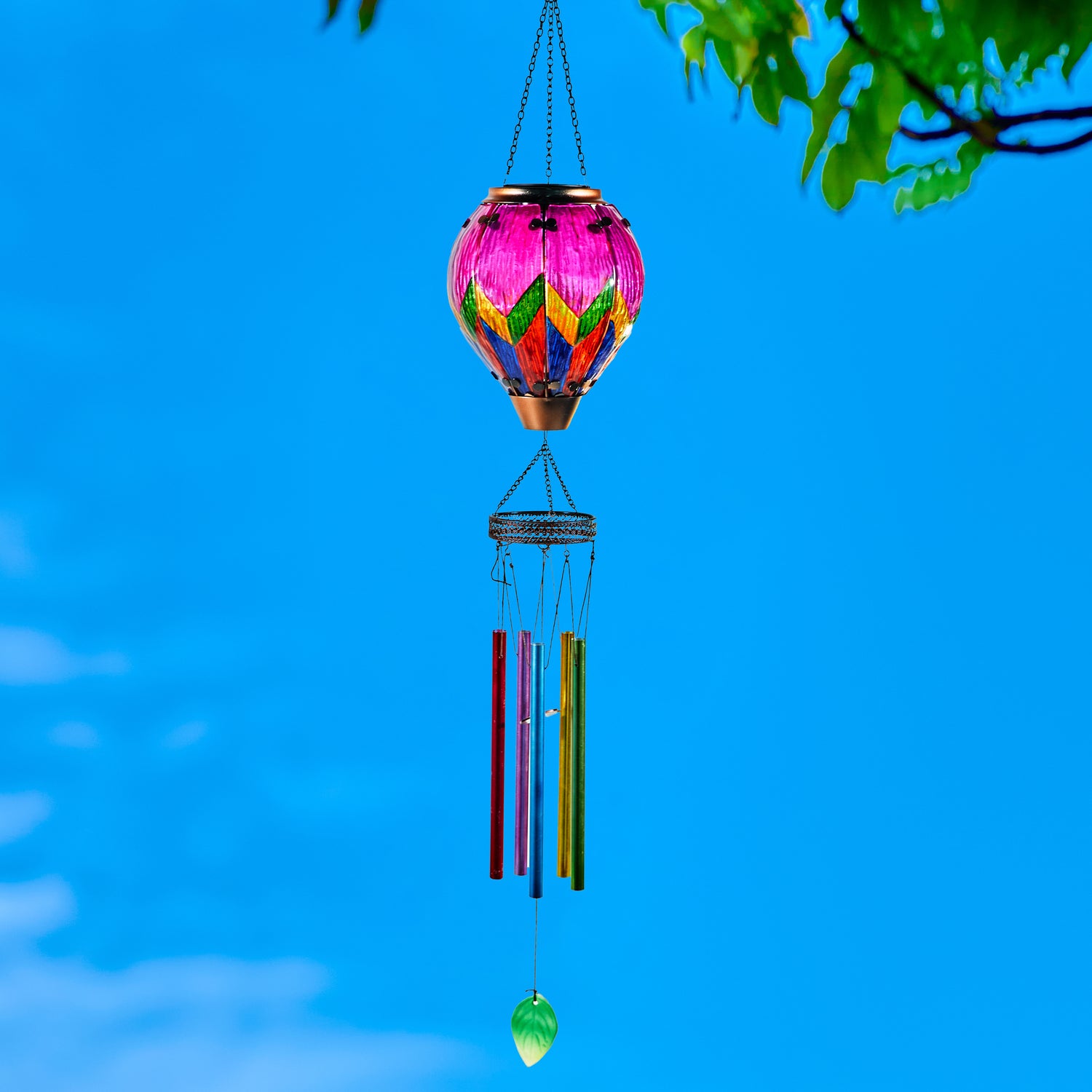 Colorful glass solar hot air balloon lantern with a hanging wind chime for backyard decorations, patio décor, and garden solar lights featuring a warm flame-effect glow