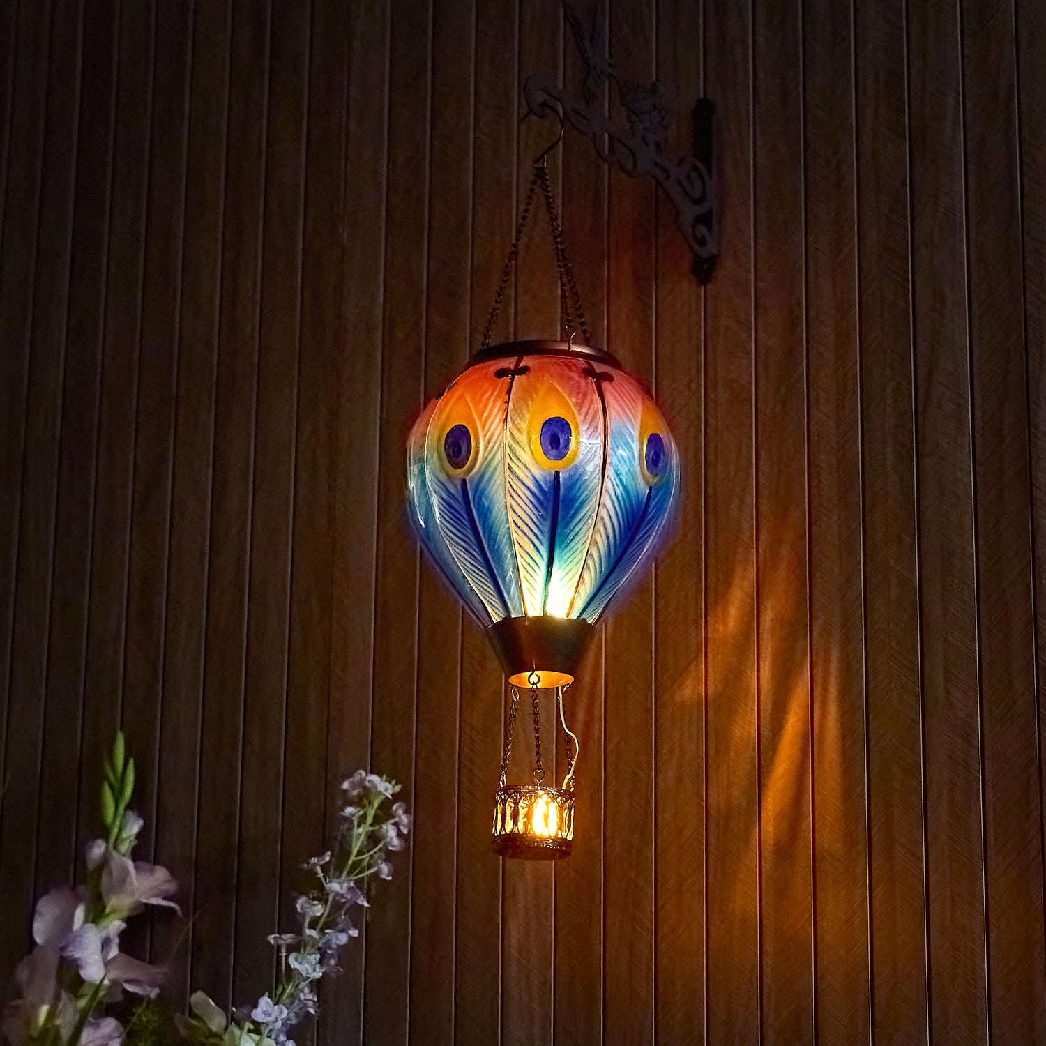 Hand-painted peacock feather solar balloon lantern for yard décor, backyard decorations, and patio solar lighting featuring a warm flame-effect solar LED