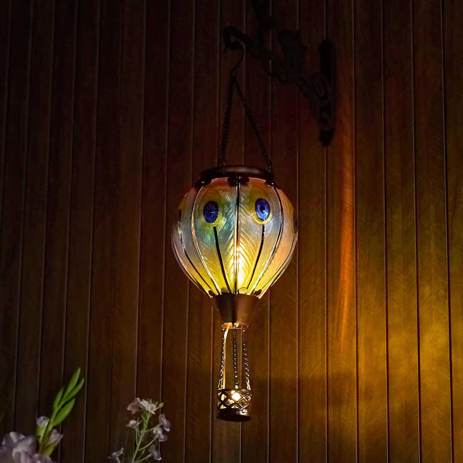 Hand-painted peacock feather solar hot air balloon lantern for backyard decorations, patio décor, and garden solar lights featuring a warm flame-effect LED glow