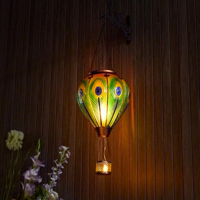 Peacock feather–pattern glass solar balloon lantern for yard decoration, backyard lights, and patio solar décor with flame-effect LED lighting