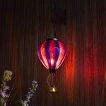 Purple hand-painted glass solar balloon lantern for garden decorations, front yard décor, and backyard lantern displays with flame-effect solar lighting