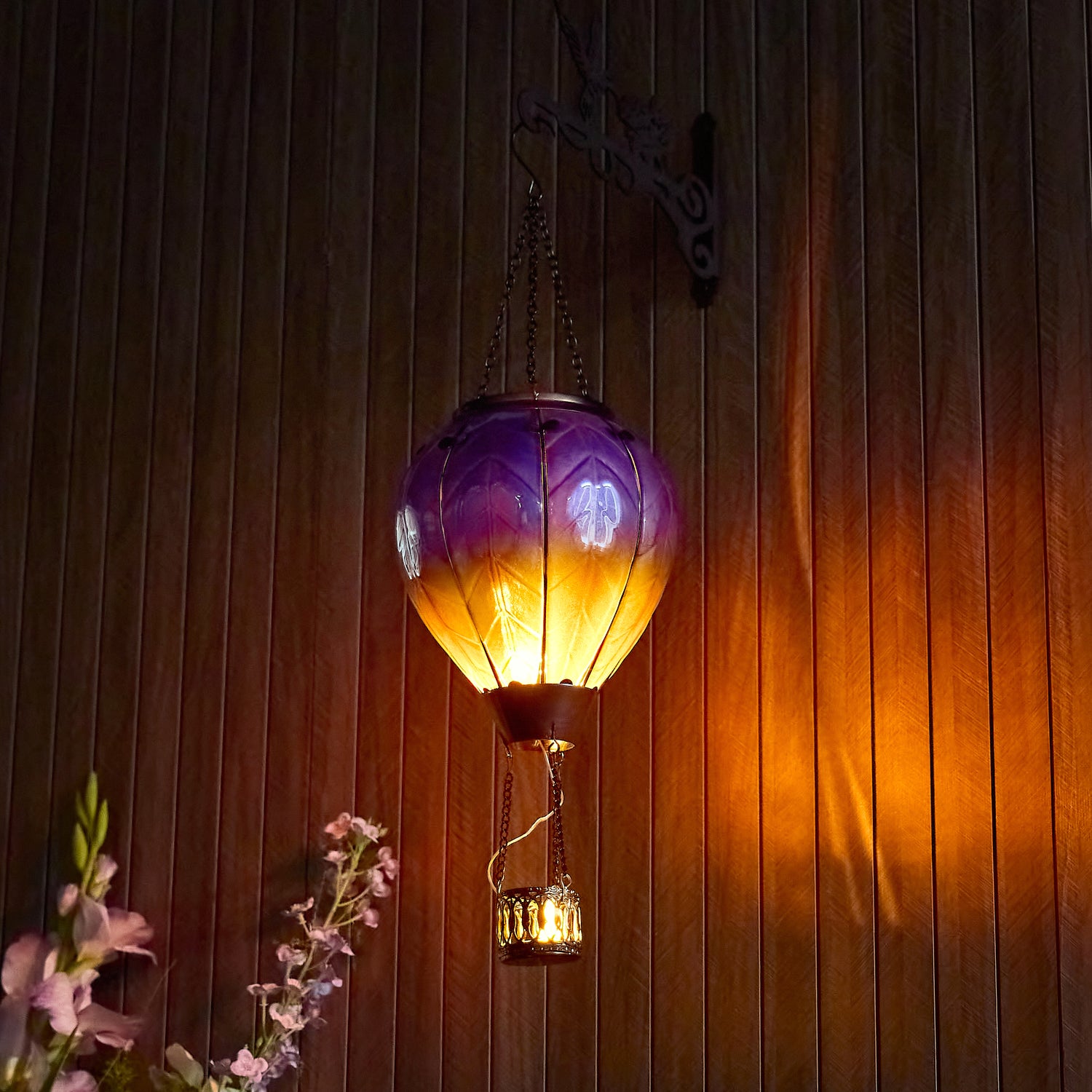 Purple hand-painted solar hot air balloon lantern for backyard decorations, patio decor, and garden solar lights with a warm flame-effect glow
