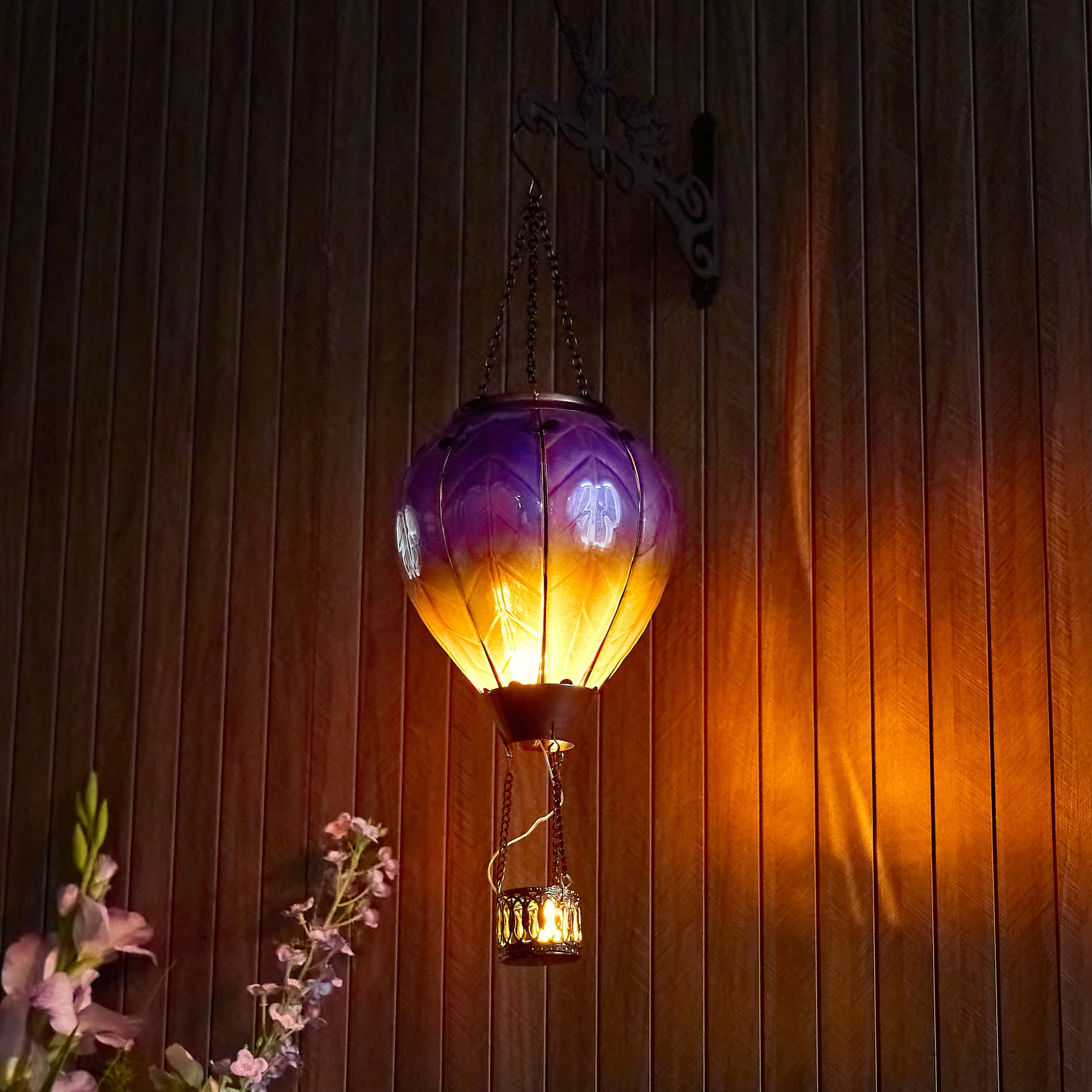 Purple hand-painted solar hot air balloon lantern for backyard decorations, patio decor, and garden solar lights with a warm flame-effect glow