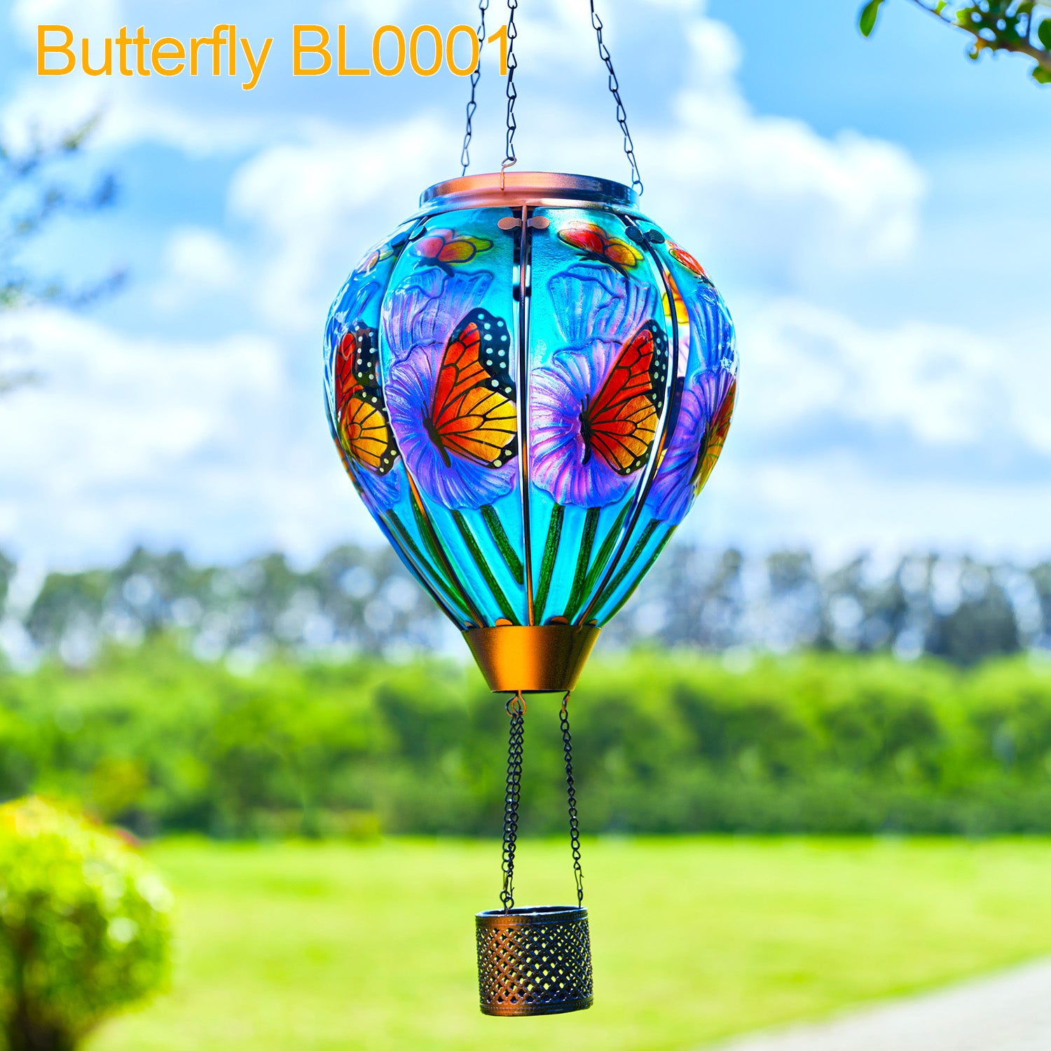 Butterfly-themed solar lantern glowing beside a path, part of a vibrant backyard solar decor and yard lantern collection