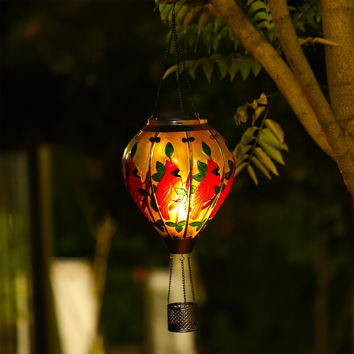Garden solar lantern with vibrant cardinal motif creating cozy ambiance in yard decorations and patio settings