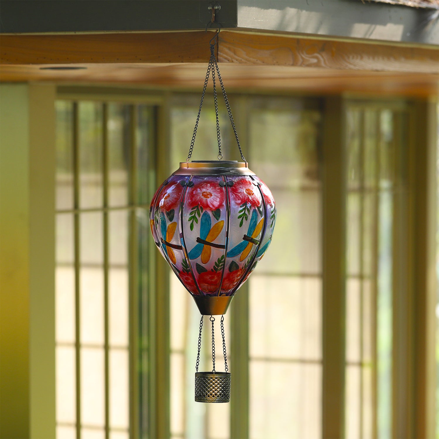 Decorative dragonfly balloon lantern with solar flame effect, creating cozy patio decor ideas for evening ambiance