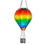Solar lantern in gradient rainbow colors brightening up the front yard, excellent for front yard decorations and solar decor