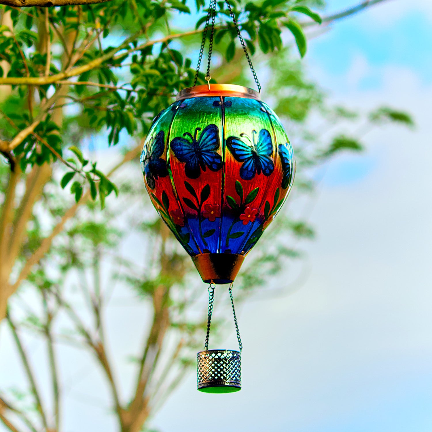 Hanging butterfly solar balloon lantern over flowers, perfect for garden solar decor and front yard decorations