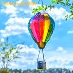 Gradient color hot air balloon lantern illuminating a patio with solar flame lamp effect, enhancing outdoor decor