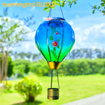 A vivid hummingbird hot air balloon lantern with solar lighting for colorful garden solar decorations and front yard decor