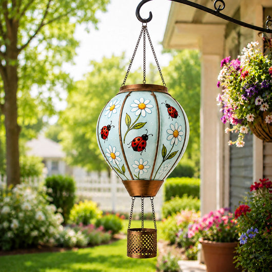 Ladybug hot air balloon solar lantern hanging in a garden patio