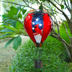 solar balloon lantern with cardinal bird and American patriotic elements glowing with LED yard lights