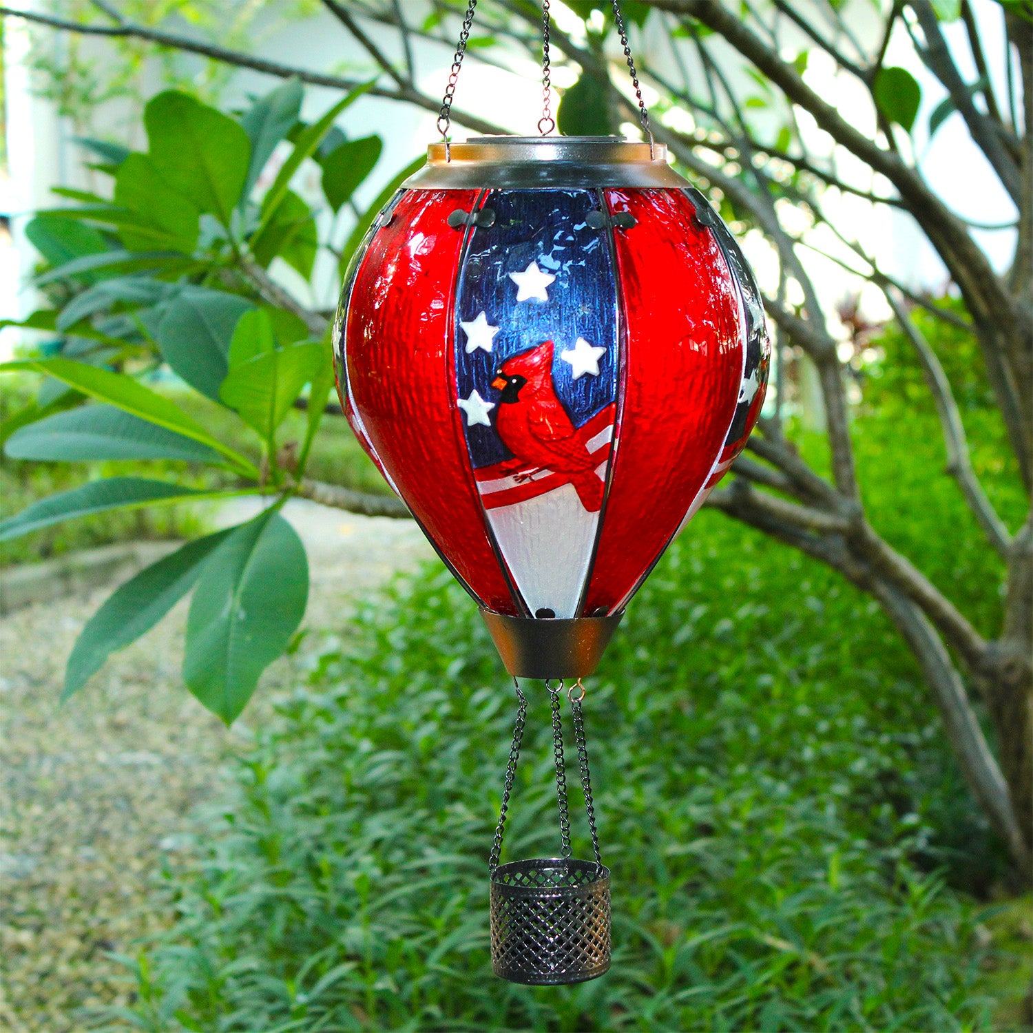 solar balloon lantern with cardinal bird and American patriotic elements glowing with LED yard lights