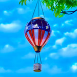 Patriotic hot air balloon solar lantern with American flag design, perfect for backyard decorations and patriotic garden lighting