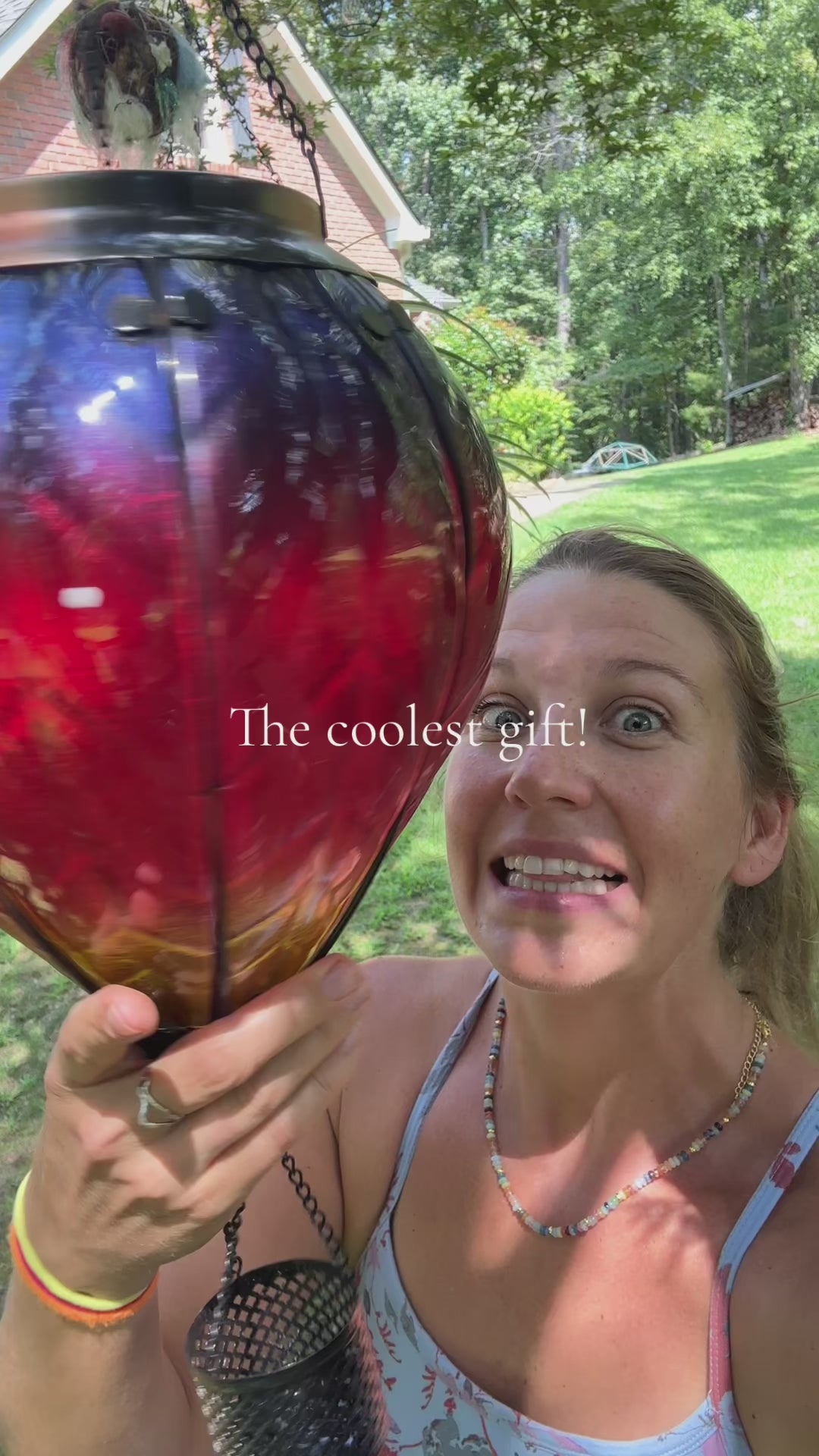 Rainbow-themed solar balloon lantern featured in a cozy front yard, an excellent piece of solar garden decor and flame lamp lighting