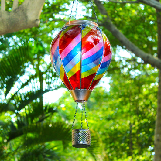 Colorful rainbow hot air balloon solar lantern used as vibrant yard decoration