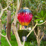 glowing rainbow hot air balloon solar lantern with LED yard lights in garden