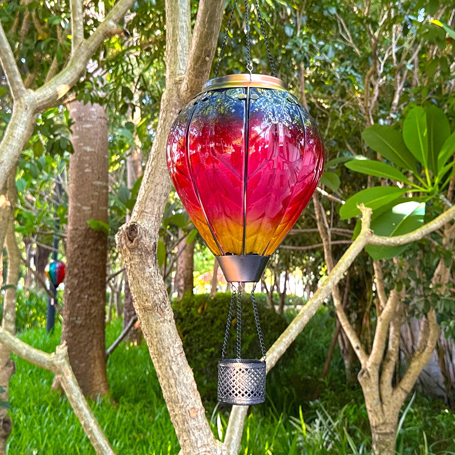 glowing rainbow hot air balloon solar lantern with LED yard lights in garden