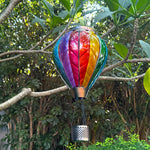 hand-painted rainbow solar lantern in daylight, perfect for front yard decor