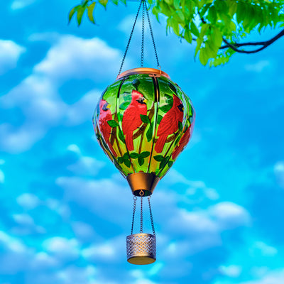 Solar lantern with hand-painted cardinal bird in red hues, perfect for front yard decor and patio solar lighting