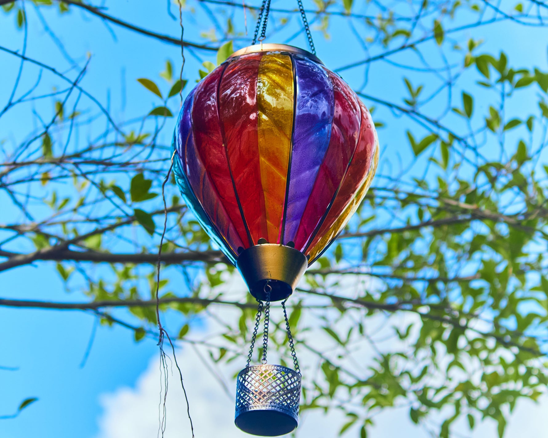Decorating garden and patio space with rainbow hot air balloon solar lantern for festive and colorful outdoor decor