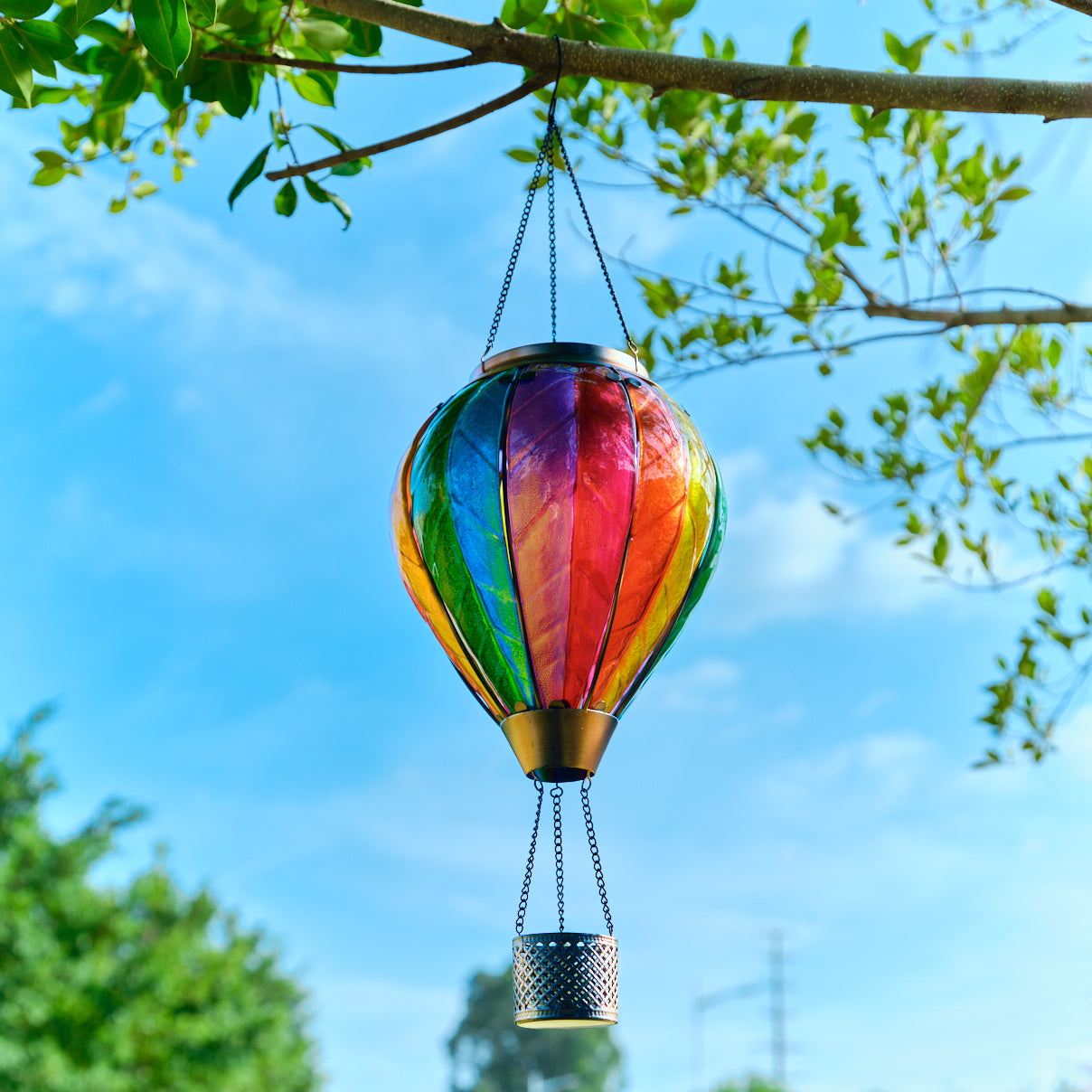 Decorating garden and patio space with rainbow hot air balloon solar lantern for festive and colorful outdoor decor