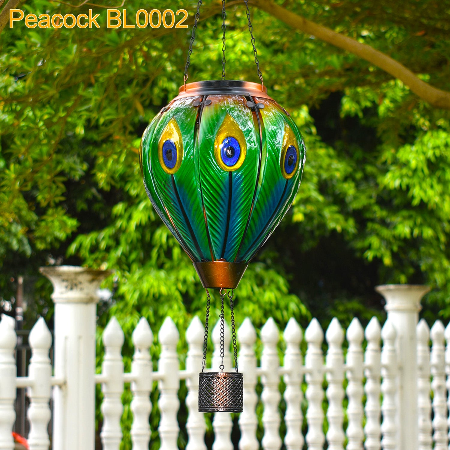 Solar-powered lantern featuring peacock tones glowing in the backyard, perfect for solar garden decor and yard lantern ambiance